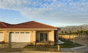Redlands apartment for rent - A house with a red tile roof and a garage door.