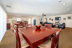 Hesperia apartment for rent - A dining room with a wooden table and chairs.