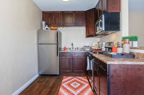 San Diego apartment for rent - a small kitchen with a stainless steel refrigerator