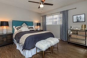 Phoenix apartment for rent - a bedroom with a bed and a ceiling fan