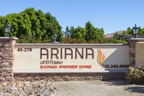Palm Desert apartment for rent - a sign for the afirma apartment homes