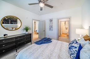 Indian Land apartment for rent - a bedroom with a large bed and a ceiling fan