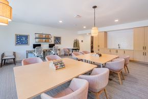 Indian Land apartment for rent - a dining room with tables and chairs and a kitchen