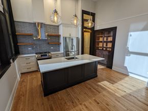 Chicago apartment for rent - a kitchen with an island in the middle of it