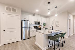 Port Charlotte apartment for rent - an open kitchen with an island and stainless steel refrigerator