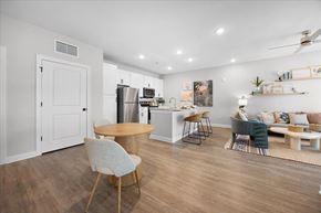 Fort Myers apartment for rent - A modern kitchen with a dining table and chairs.