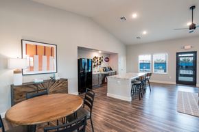 Austin apartment for rent - A modern dining room with a wooden table and chairs.