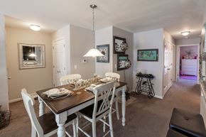 Michigan City apartment for rent - A dining room with a table set for four.