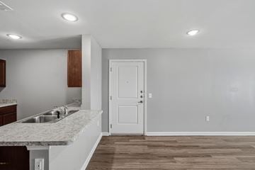 San Antonio apartment for rent - A kitchen with a sink and a door.