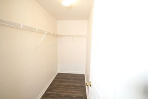 Batesville apartment for rent - A room with a white wall and a wooden floor.