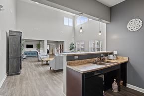 Columbus apartment for rent - A kitchen with a sink and a countertop with a bag of chips on it.