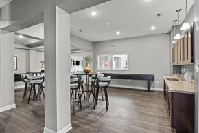 Columbus apartment for rent - A modern dining room with a long table and chairs.
