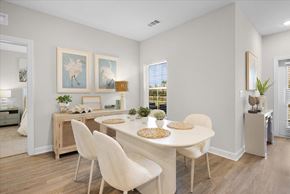 Fort Myers apartment for rent - A dining room with a white table and chairs.