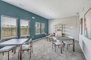 Houston apartment for rent - A conference room with a long table and chairs.