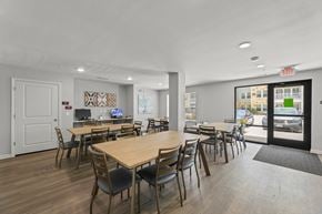 Houston apartment for rent - A conference room with a long table and chairs.