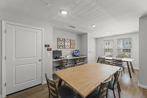 Houston apartment for rent - A dining room with a wooden table and chairs.