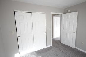 Connersville apartment for rent - Bedroom with two closets and a doorway at Conner Court apartments in Connersville, IN