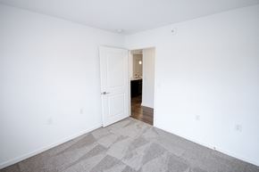 Columbus apartment for rent - An empty bedroom with carpeted floor indmiller Pointe apartments in Columbus, Ohio