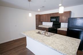 Columbus apartment for rent - A kitchen with sink, fridge, and stove indmiller Pointe apartments in Columbus, Ohio