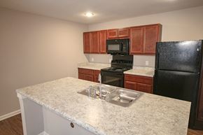 Whitestown apartment for rent - Kitchen with sink and stove at Meadows on Main in Whitestown, Indiana