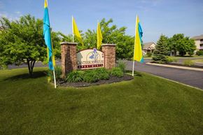 Kalamazoo apartment for rent - a sign in the grass for Canterbury Apartments in Kalamazoo, MI
