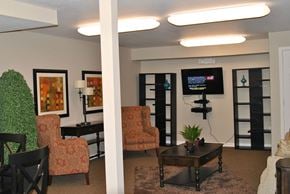 Indianapolis apartment for rent - a lounging area with chairs and a coffee table