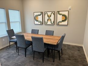 Kansas City apartment for rent - A conference room with a long table and chairs.