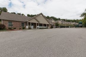 Southgate apartment for rent - A house with a grey roof and a driveway in front.