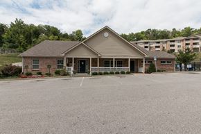 Southgate apartment for rent - A building with a parking lot in front of it.
