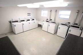Indianapolis apartment for rent - a large room with many washing machines in it