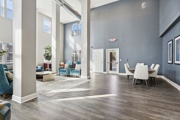 Slidell apartment for rent - an open living room and dining room with a table and chairs