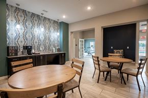 Avon apartment for rent - Clubhouse room with a table and chairs and a counter with a coffee maker at Mosaic Apartments in Avon, Indiana
