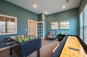 Avon apartment for rent - Game room with a foosball table and shuffle board at Mosaic Apartments in Avon, Indiana