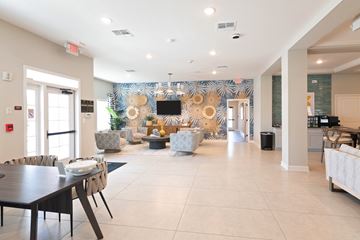 Newberry apartment for rent - A modern living room with a dining table and chairs.