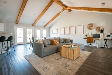 Newburgh apartment for rent - A living room with a grey couch and a wooden coffee table.