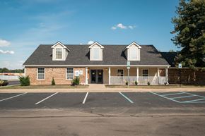 Newburgh apartment for rent - A building with a parking lot in front of it.