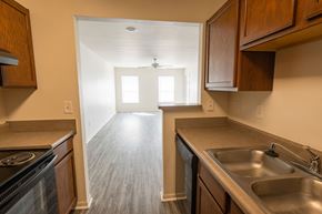 Newburgh apartment for rent - A kitchen with a stove, sink, and cabinets.