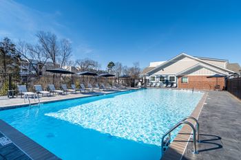 Sparkling pool with expansive sundeck