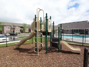 Warsaw apartment for rent - a playground with two slides at canterbury house apartments in warsaw indiana