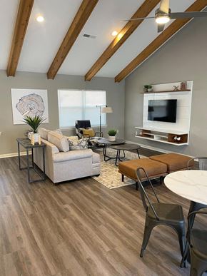 Columbus apartment for rent - Clubhouse lounge area with couch and table at Canterbury House Apartments in Columbus Indiana