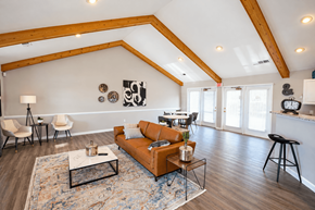 La Porte apartment for rent - A living room with a brown couch and a coffee table.