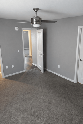 San Antonio apartment for rent - A room with a ceiling fan and carpeted floor.