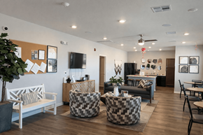 San Antonio apartment for rent - A living room with a white bench and a black and white checkered ottoman.