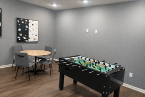 San Antonio apartment for rent - A pool table is in the middle of a room with a table and chairs.