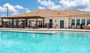 North Port apartment for rent - The pool and exterior clubhouse at the Flats at Sundown in North Port, Florida