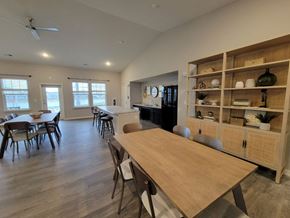 Indianapolis apartment for rent - a dining room and living room with a table at Southern Meadows Apartments