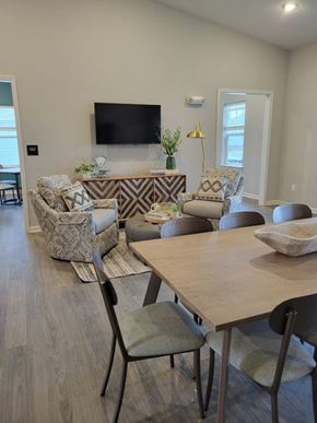 Indianapolis apartment for rent - a living room with a table and chairs at Southern Meadows apartments
