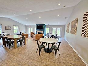 Southgate apartment for rent - A spacious room with a fireplace and a television.