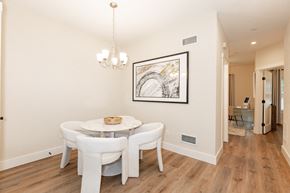 West Babylon apartment for rent - A dining room with a white table and chairs.