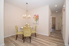 North Babylon apartment for rent - A dining room with a table set for four.